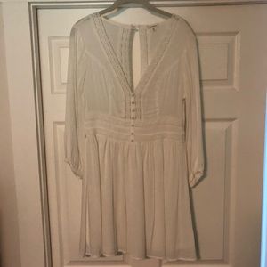 White lacy long sleeve dress with open back